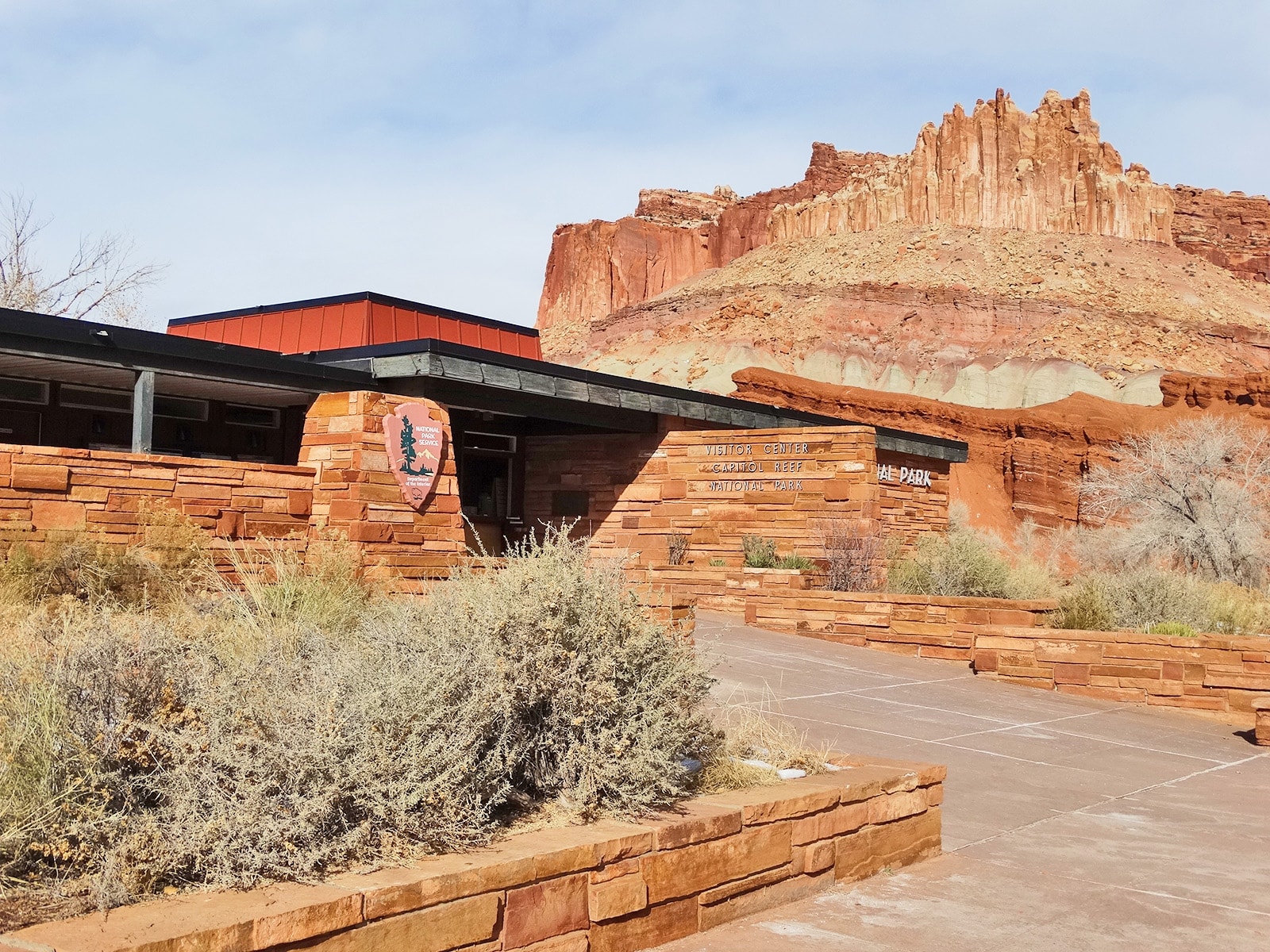 Cliffs known as "The Castle" tower above the Capitol Reef Visitor Center