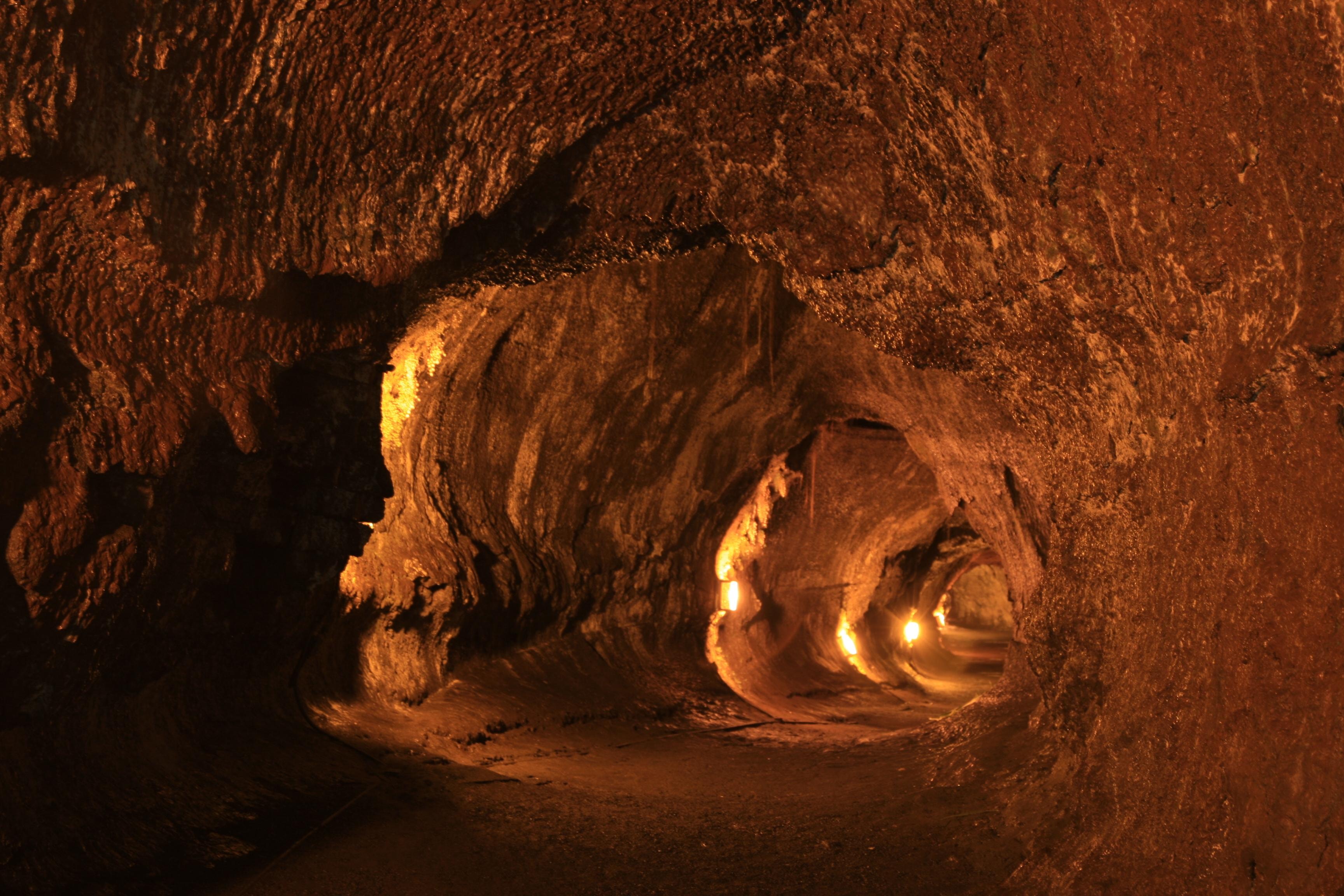 A lava tube lit by warm electric light